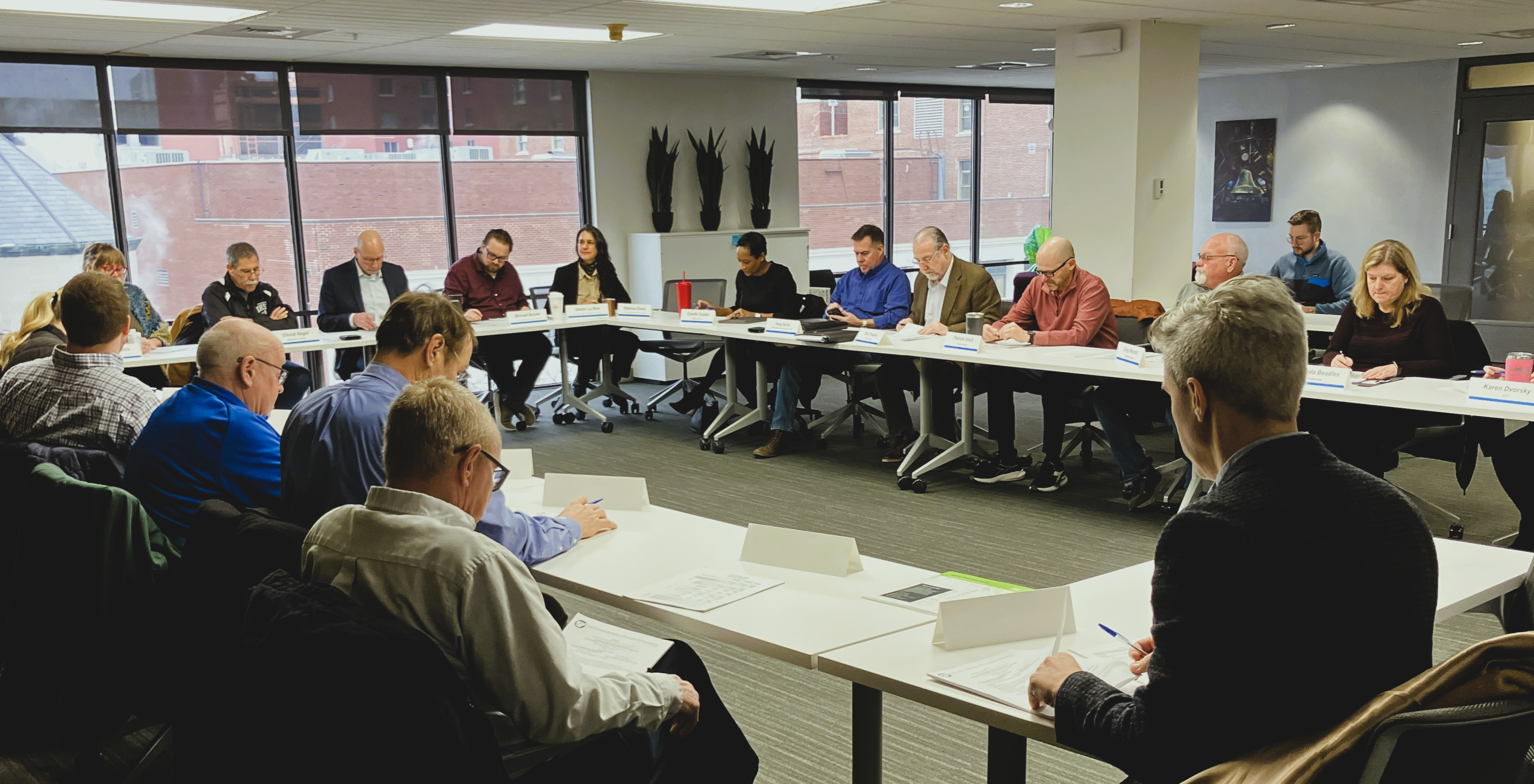 Board Members sitting around table during February 4, 2026 meeting